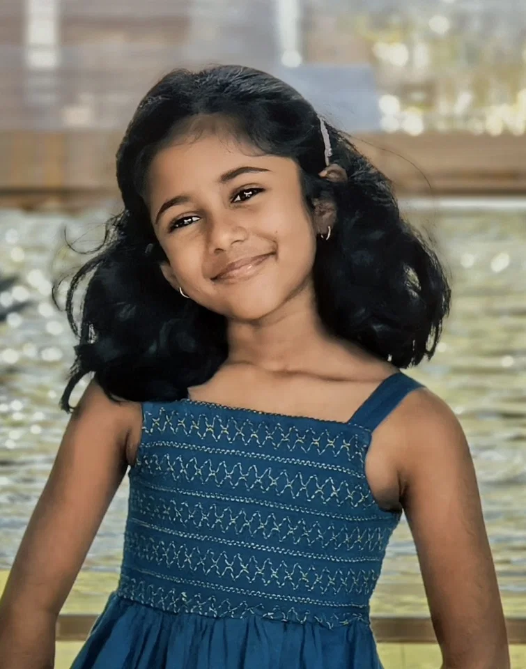 Siya smiling in a blue dress